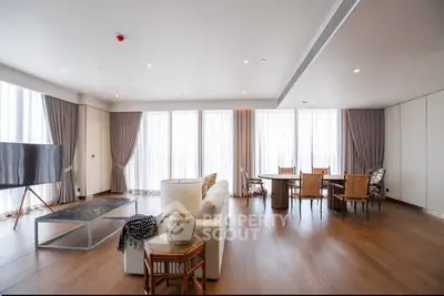 Spacious modern living room with elegant decor and ample natural light