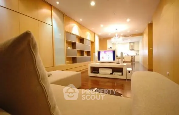 Spacious modern living room with open layout and elegant lighting.