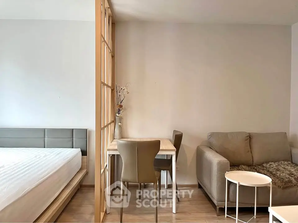 Modern studio apartment with cozy living area and stylish furniture