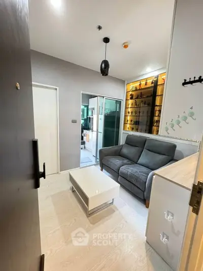 Modern living room with sleek furniture and stylish decor in a cozy apartment.