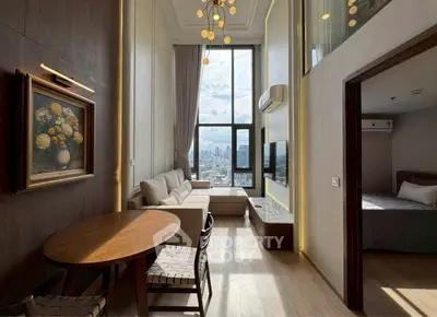 Luxurious high-ceiling living room with stunning city view and elegant decor