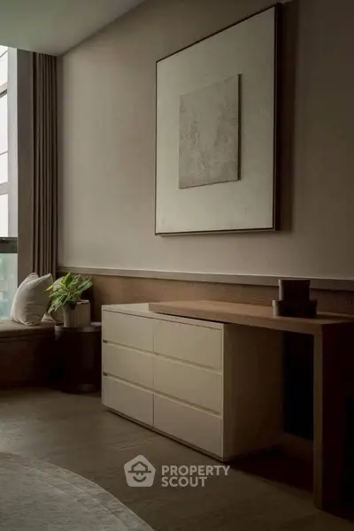 Elegant modern living room with stylish furniture and large window for natural light.