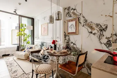 Luxurious open-plan living room with elegant marble accents and stylish dining area.