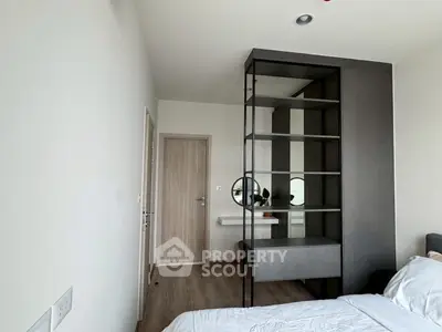 Modern bedroom with stylish shelving and minimalist decor