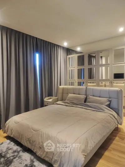 Luxurious bedroom with elegant decor and plush bedding in modern apartment