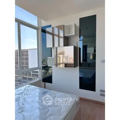 Modern bedroom with large windows and stylish wall shelves in urban apartment.