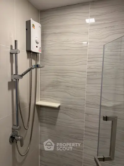 Modern bathroom with sleek shower and elegant tile design