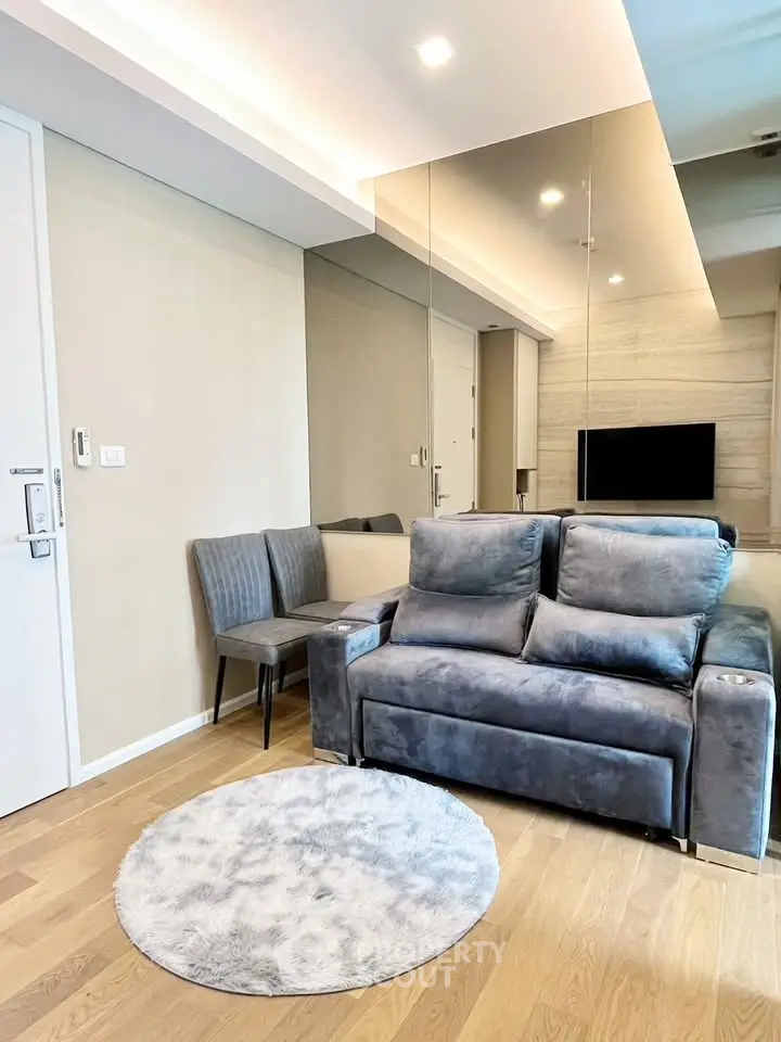 Modern living room with plush gray sofa and stylish decor