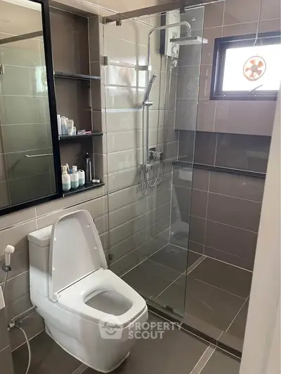 Modern bathroom with sleek glass shower and contemporary fixtures