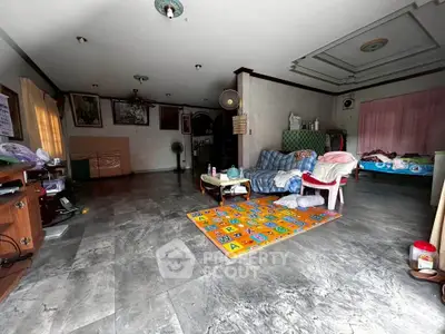 Spacious living room with tiled floor and cozy seating area