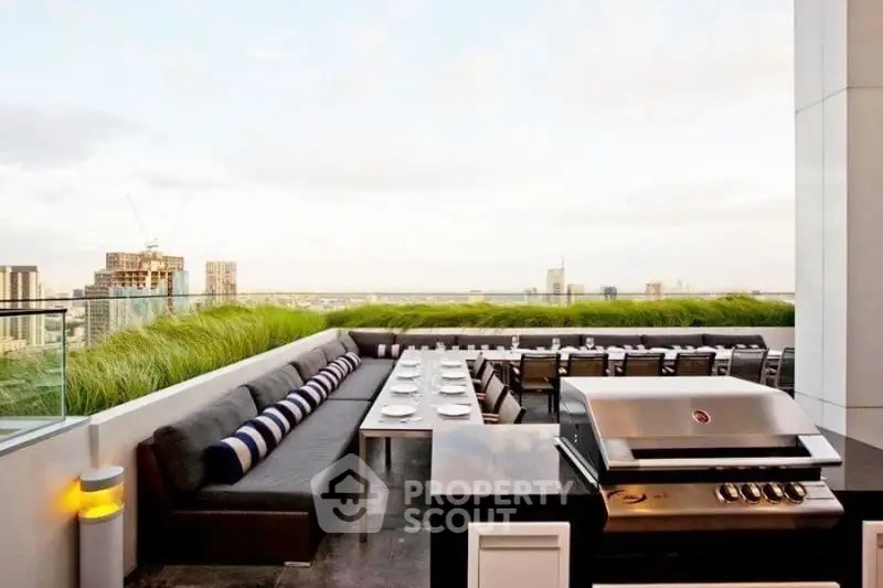 Luxurious rooftop BBQ area with stunning city views and modern seating arrangement.