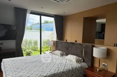 Luxurious bedroom with garden view and elegant decor