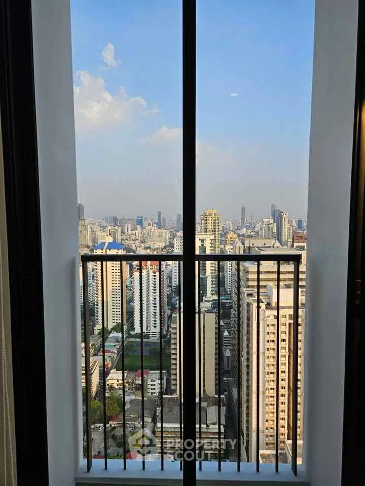Stunning cityscape view from a high-rise balcony, perfect for urban living enthusiasts.