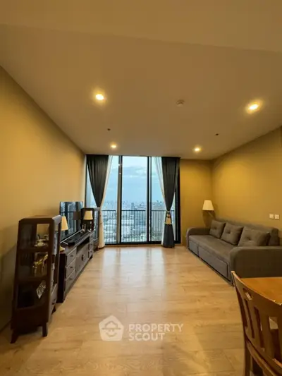 Spacious living room with panoramic city view and elegant furnishings