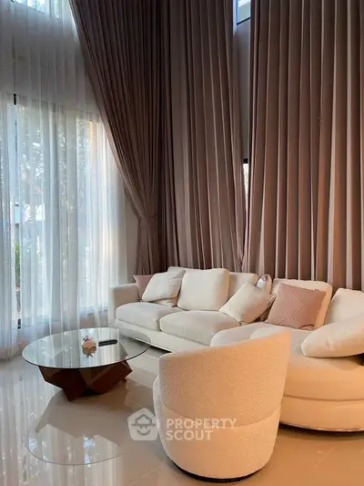 Luxurious living room with elegant drapes and modern furniture