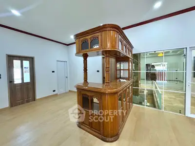 Spacious interior with elegant wooden bar and modern glass partition