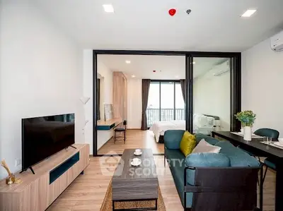 Modern open-concept living room with stylish furniture and natural light