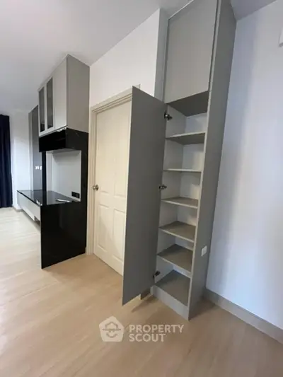 Modern apartment interior with sleek storage solutions and minimalist design