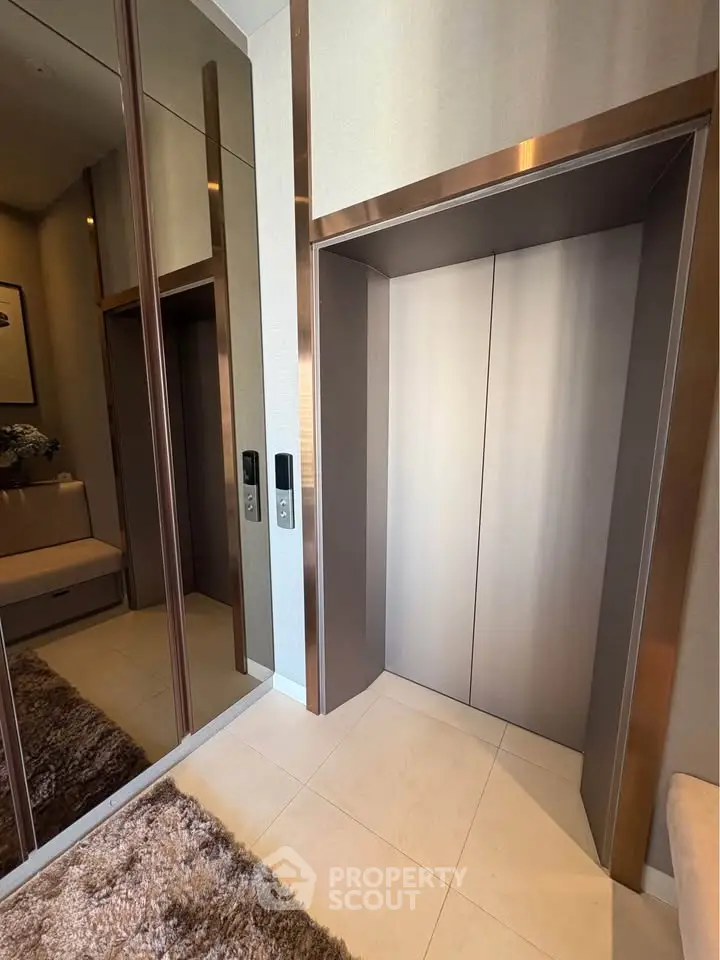 Modern building elevator with sleek design and mirrored walls
