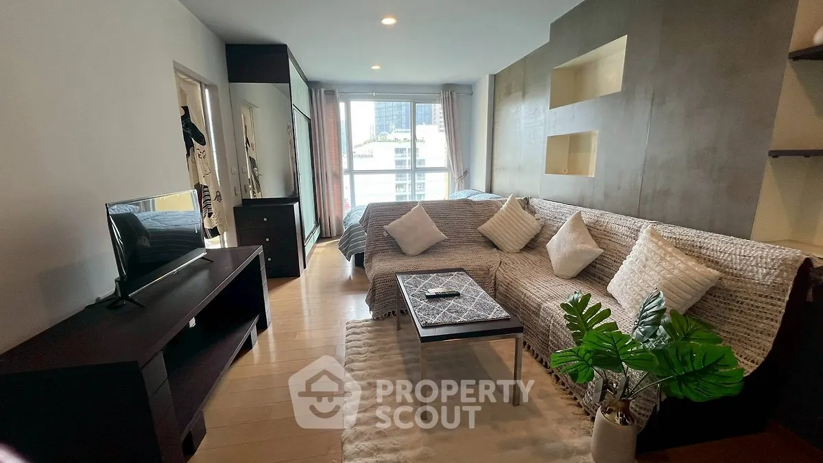 Modern studio apartment with cozy living area and stylish decor