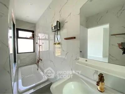Modern bathroom with marble tiles and elegant fixtures
