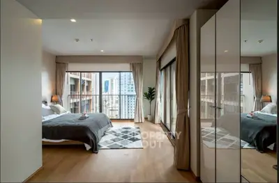 Spacious modern bedroom with city view and elegant decor