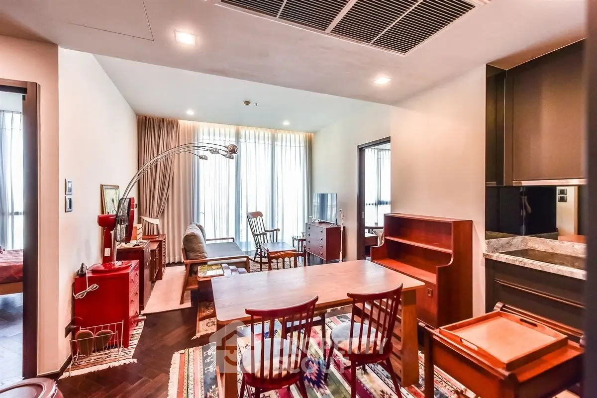 Stylish open-plan living and dining area with modern furniture and natural light