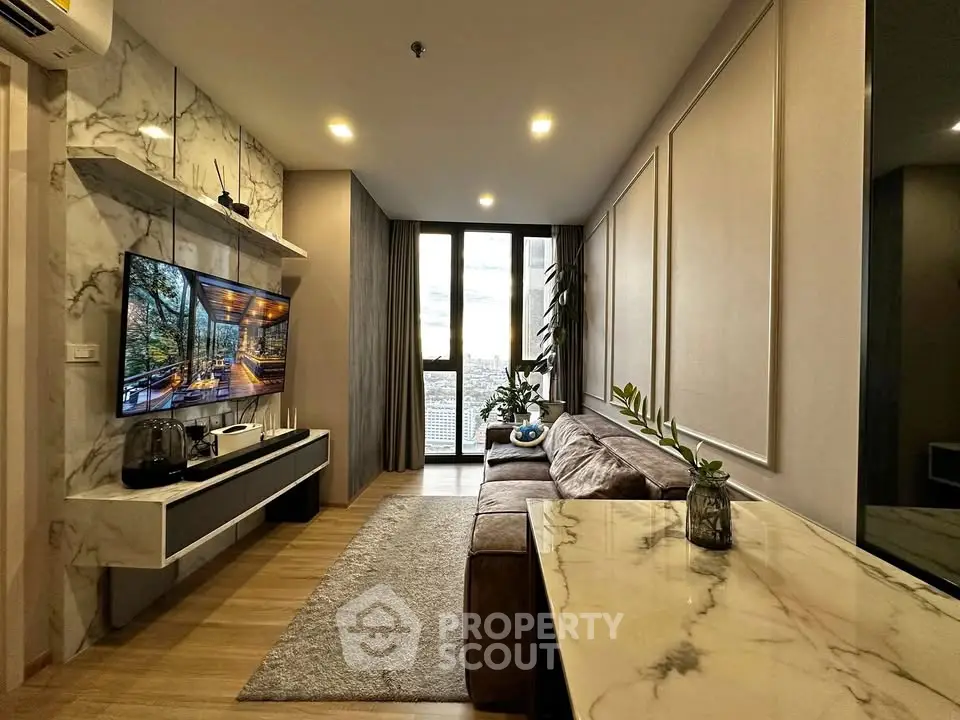 Luxurious modern living room with marble accents and stunning city view.