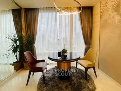 Elegant living room with city view, modern chairs, and stylish decor