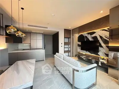 Luxurious modern living room with open kitchen and stylish decor