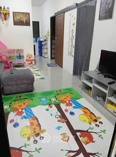 Charming family living room with playful decor and modern furnishings.