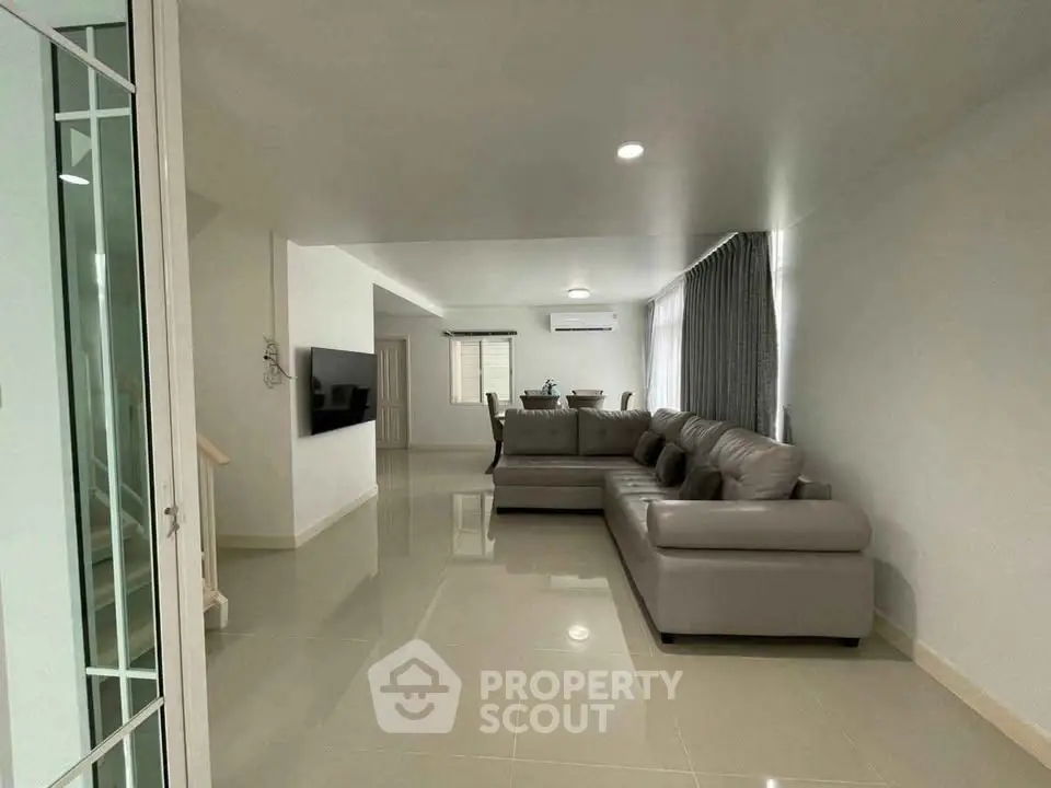 Spacious modern living room with sleek furniture and open layout