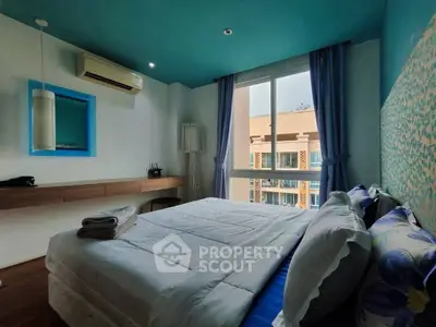 Cozy bedroom with modern decor and large window view