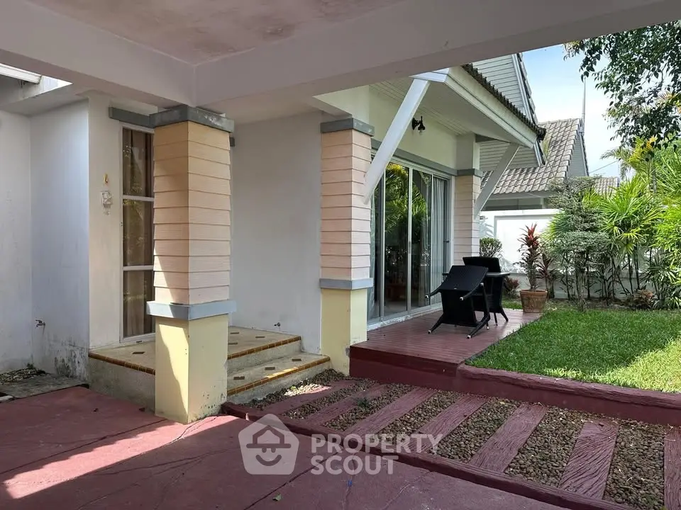 Charming patio with garden view and outdoor seating in suburban home