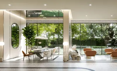 Luxurious modern living room with floor-to-ceiling windows and garden view.