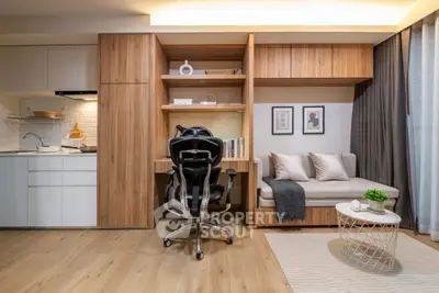Modern studio apartment with stylish workspace and cozy seating area