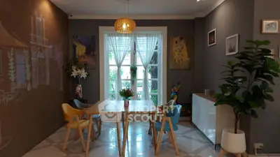 Charming dining area with modern decor and natural light, perfect for cozy gatherings.