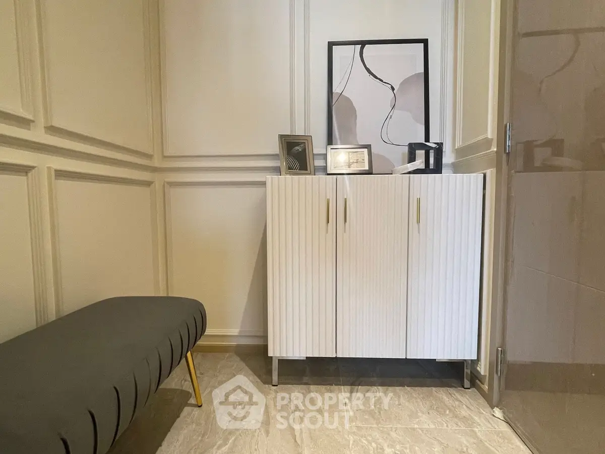 Stylish entryway with modern cabinet and elegant decor accents