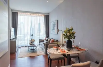 Modern living room with dining area and city view, featuring elegant decor and natural light.