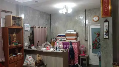 Cozy living room with eclectic decor and ample storage space