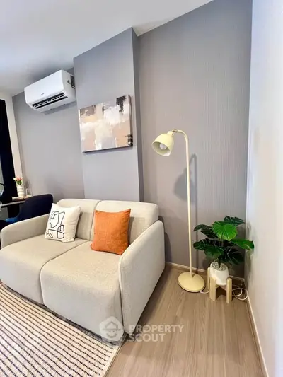 Modern living room with stylish decor and cozy sofa in a contemporary apartment.