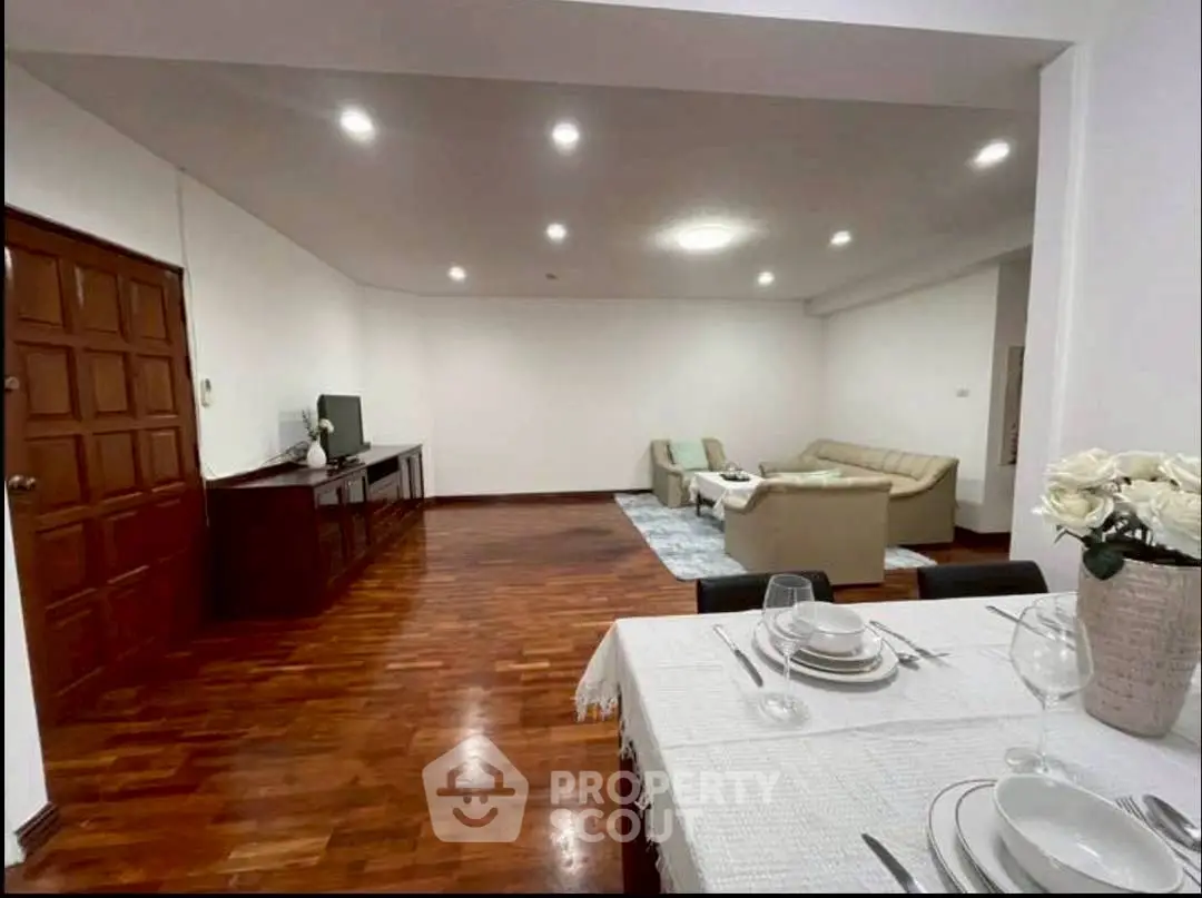 Spacious living room with elegant dining area and cozy seating, perfect for entertaining.