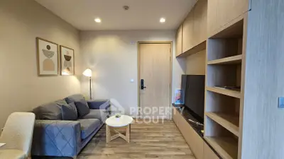 Modern living room with cozy sofa and wooden accents