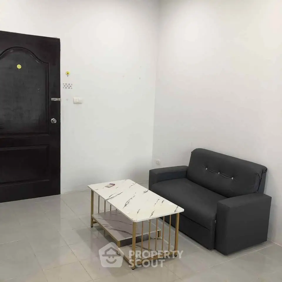 Minimalist living room with modern sofa and marble coffee table