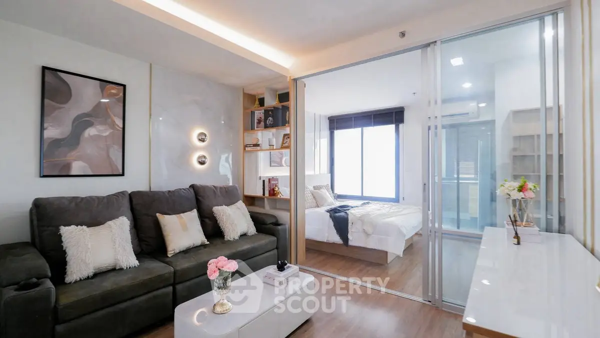 Modern living room with stylish decor and cozy bedroom view