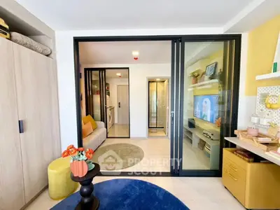 Modern living room with sliding glass doors and vibrant decor