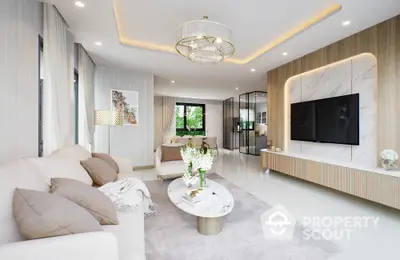 Luxurious modern living room with elegant decor and large TV, featuring a stylish chandelier and cozy seating area.