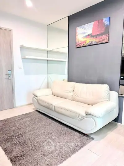 Modern living room with sleek white sofa and stylish decor