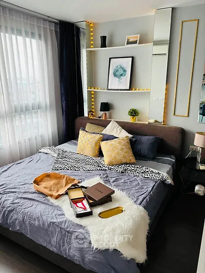 Stylish bedroom with modern decor, cozy bedding, and ambient lighting for a relaxing atmosphere.