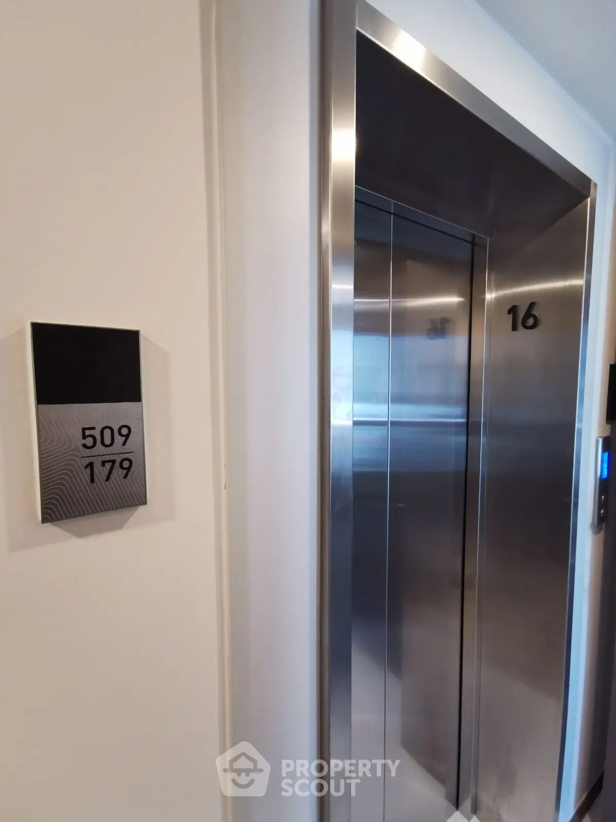 Modern building elevator with sleek design and floor indicator, perfect for urban living convenience.